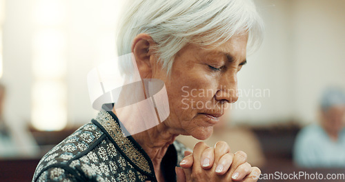 Image of Senior, prayer or old woman in church for God, holy spirit or religion in cathedral or Christian community. Faith, spiritual or face of elderly person in chapel or sanctuary to praise Jesus Christ