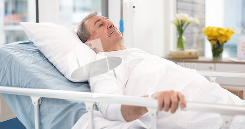 Image of Man, cancer and patient in hospital bed thinking about healthcare, wellness and healing in clinic after surgery. Medical treatment, sick and person with health problem in hospice for recovery in icu