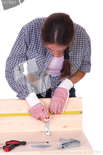 Image of woman carpenter at work