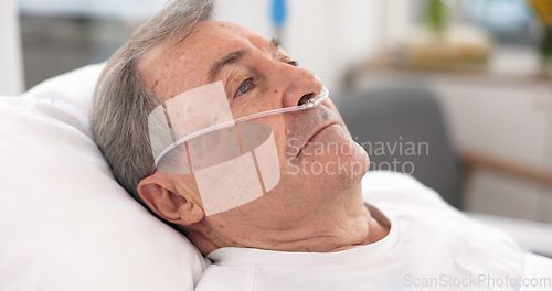 Image of Oxygen, hospital bed and senior man with ventilation and breathing tube support in a clinic. Elderly patient, medical care and emergency room with male person at a doctor for wellness and healthcare