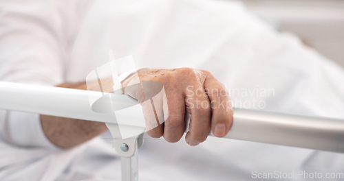 Image of Hand on rail, patient and hospital bed for healthcare, wellness and healing in clinic after cancer surgery. Medical treatment, sick and person in bedroom with health problem in hospice of clinic