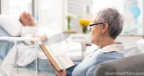 Image of Healthcare, an old woman reading the bible to her husband during a visit and a couple in the hospital. Medical, retirement or religion with a senior wife and man patient at a clinic for faith in god