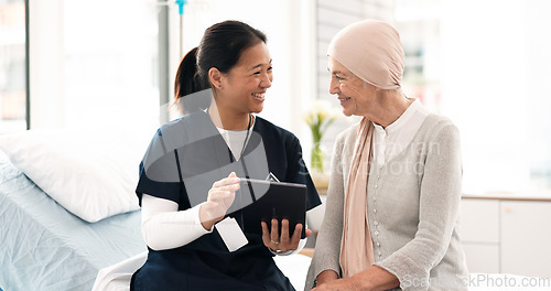 Image of Tablet, nurse and woman with cancer patient in hospital, consultation and wellness. Technology, happy and medical professional with sick senior person for advice, healthcare and support in clinic