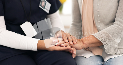 Image of Senior person, holding hands and caregiver empathy, support and elderly care for client with medical problem. Retirement home, wellness and closeup clinic therapist, surgeon or nurse with kindness