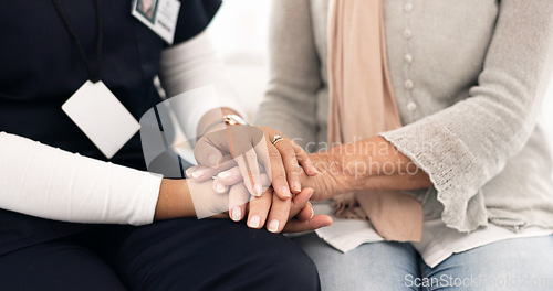 Image of Senior person, holding hands and caregiver empathy, support and elderly care for client with medical problem. Retirement home, wellness and closeup clinic therapist, surgeon or nurse with kindness