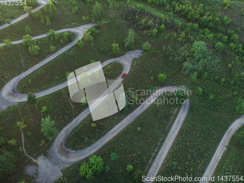 Image of Aerial top vew of winding road in the city