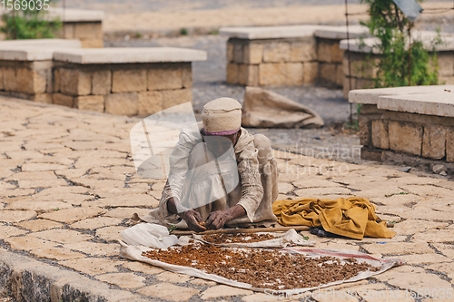 Image of Old woman sell incense in Aksum, Ethiopia Africa