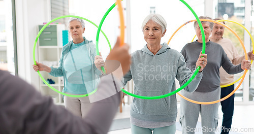 Image of Fitness, senior and people with hula hoop at the gym for training, workout and health in retirement. Happy, together and a group of elderly friends with a coach and gear for an exercise class