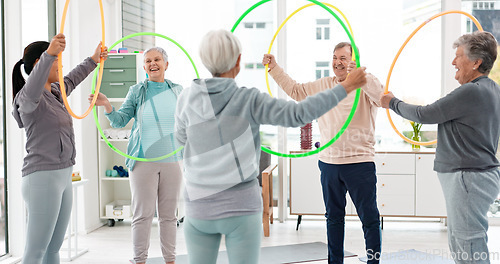 Image of Fitness, senior and people with hula hoop at the gym for training, workout and health in retirement. Happy, together and a group of elderly friends with a coach and gear for an exercise class