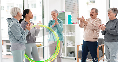 Image of Fitness, senior and people with celebration at gym at end or exercise class for wellness. Elderly, group and friends in studio to congratulation after workout in retirement with coach and hula hoop.