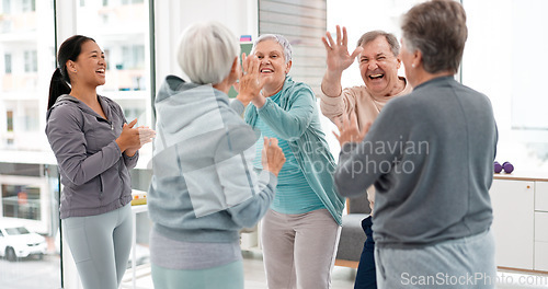 Image of Fitness, hands together and senior people for exercise support, celebration and teamwork in workout class. Exercise, training goal and group of elderly man and women with high five for health success