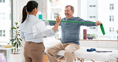 Image of Physical therapy, patient and chiropractor, stretching with resistance band and muscle with high five. Help, support and woman with old man at clinic, elderly care and fitness with physio success