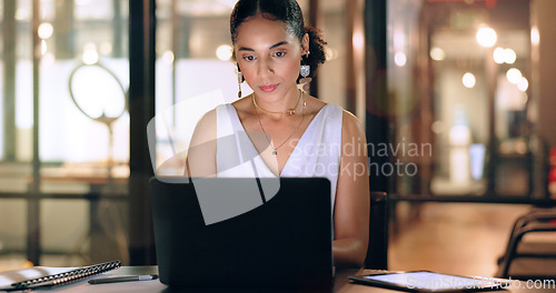 Image of Business woman with technology, typing and working night to meet deadline, kpi target and overtime with laptop and tablet. Black woman, corporate workplace and focus, schedule and overtime at office.