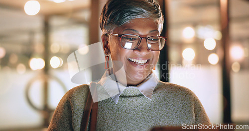 Image of Face, tablet and senior woman in office laughing at funny meme or video at night. Technology, break and happy elderly female with touchscreen on social media reading comic story after working late.