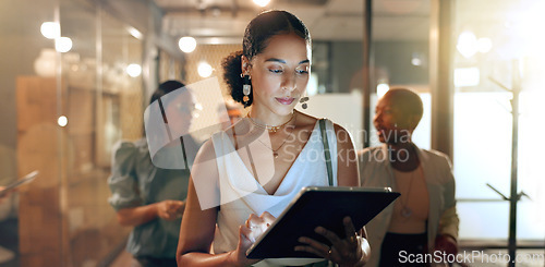 Image of Tablet, team and black woman in office walking to business meeting doing research, online and using internet. Teamwork, leadership and group of busy female workers together in corporate workplace