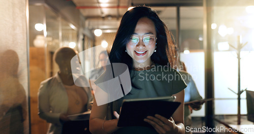 Image of Night, tablet and business people walking in office after finishing work task. Tech, overtime and Asian woman with group of friends going home after working late on sales project in dark workplace.