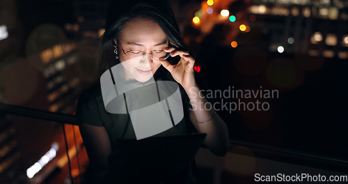 Image of Glasses, tablet and Asian woman in night office, working late on project deadline or research. Tech, overtime and female employee with touchscreen reading email, report or proposal in dark workplace.