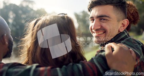 Image of Happy, face and man with friends on lake, camping in nature or group laughing and bonding on outdoor picnic at the park. Portrait, person or smile in conversation, social gathering or relax in woods