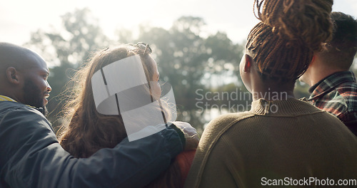 Image of Happy, face and woman with friends on lake, camping in nature or group laughing and bonding on outdoor picnic at the park. Portrait, smile and girl relax in conversation or social gathering in woods