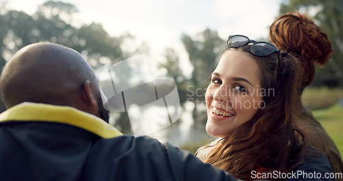 Image of Happy, face and woman with friends on lake, camping in nature or group laughing and bonding on outdoor picnic at the park. Portrait, girl or smile in conversation, social gathering or relax in woods