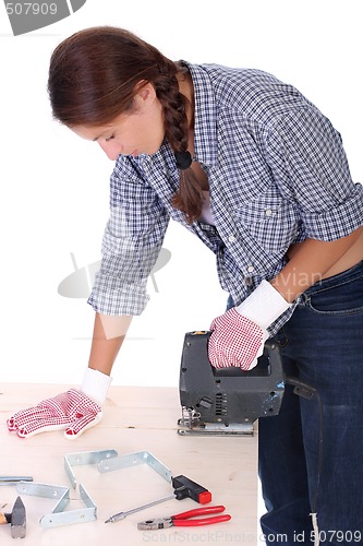 Image of woman carpenter at work