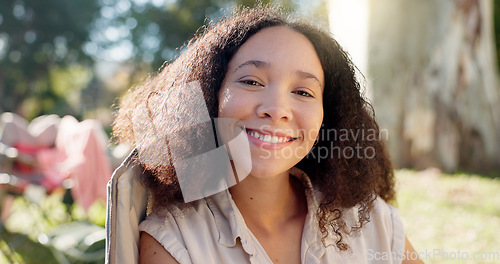 Image of Nature, face of happy woman in chair and camping in forest for vacation, adventure and freedom. Relax at camp, smile and girl sitting in woods with trees, grass and happiness on eco friendly holiday.