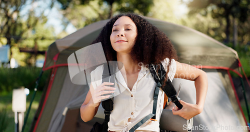 Image of Camping, smile and a woman with a backpack in nature for hiking, trekking or adventure in the morning. Happy, ideas and a young girl with a bag for a journey, walk or vacation in the mountains