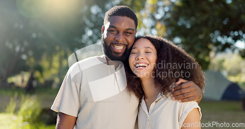 Image of Love, diversity and a camping couple hugging outdoor in nature together while bonding for adventure. Summer, smile or romance with an interracial man and woman in the woods or forest to explore