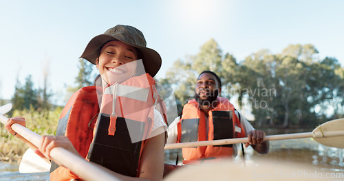 Image of Couple, kayak and rowing on a lake in nature for sports challenge, adventure or travel with a smile. Young man and woman friends together on boat and water for fitness, travel and holiday for freedom