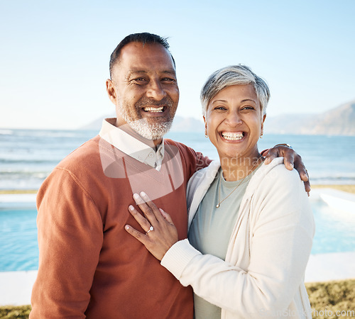 Image of Senior couple, hug and portrait at the beach, love and care with bonding, travel and trust in a marriage. Life partner, ocean and adventure in nature, people on holiday with retirement and happiness