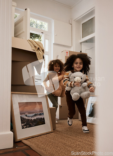 Image of Girl, children and happy in new home, running and toys with game, moving and excited for new beginning. Kids, teddy bear and playful with games at door in apartment, family house and freedom in lobby