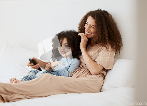 Image of Bedroom, happy family child and mother watching tv series, movie or streaming online video, cinema or entertainment. Home bed, kids and relax woman, mom or mama watch cartoon show, television or film