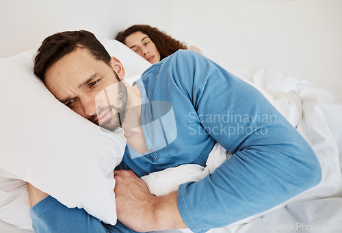 Image of Divorce, fight and angry couple in bed after fight, discussion or frustrated by cheating wife at home. Bedroom, problem and man ignore annoyed woman with depression, anxiety or erectile dysfunction