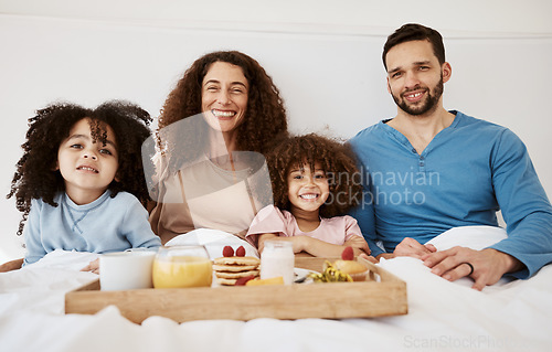 Image of Happy children, parents or portrait of breakfast in bed, food and enjoy quality time together, comfort and stress relief. Happiness, family home apartment or bedroom kids, mom and dad relax with meal