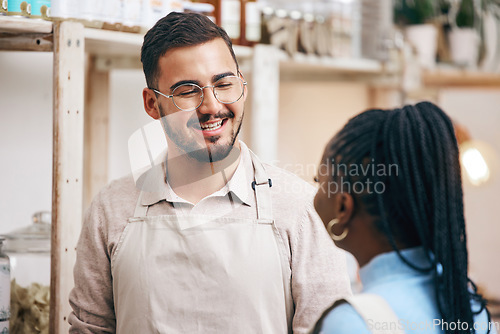 Image of Shopping, grocery store and man with customer for help, assistance and service in eco friendly market. Small business, sustainable shop and manager with black woman for groceries, products and food