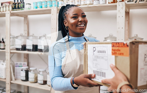 Image of Woman, small business and store with box delivery, smile and reception for supply chain, product and commerce. African entrepreneur, cardboard package or happy for courier service in sustainable shop