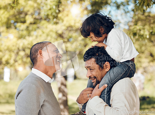 Image of Senior father, piggyback and child in park for bonding fun, games and trust in backyard garden. Smile, happy and playing dad carrying boy kid on shoulders with parent, family and senior grandfather