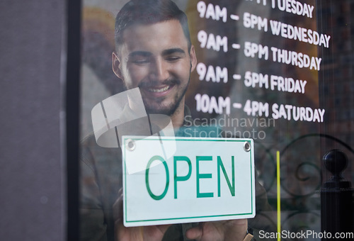 Image of Shop, window and happy businessman open with sign for working time in retail, store or service in small business. Opening, restaurant or startup owner in Portugal with a welcome, poster and smile