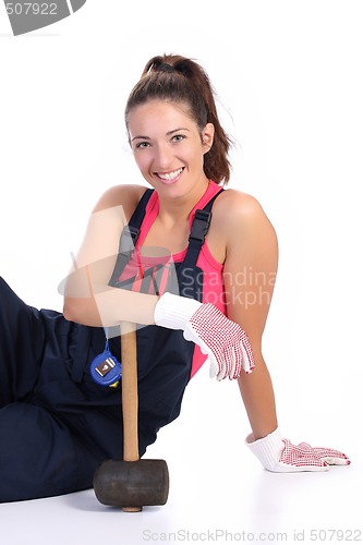 Image of woman with black rubber mallet 