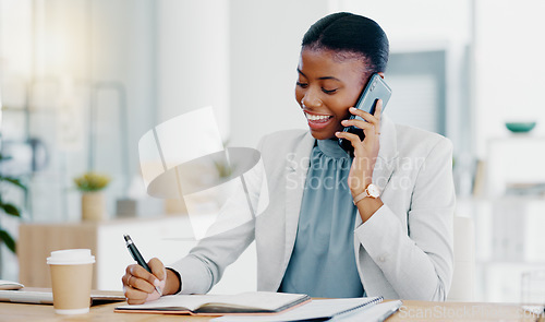 Image of Black woman, phone call and writing in book consulting for financial advice, conversation or communication at office. Happy African female accountant talking on smartphone checking data on computer