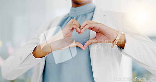 Image of Hands, heart and business woman with love emoji for care, kindness and symbol in office. Closeup of happy female worker with finger shape for thank you, trust and sign of hope, support icon and peace