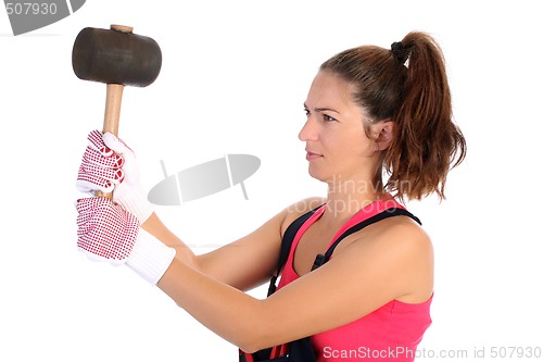 Image of woman with black rubber mallet 