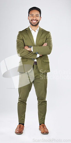 Image of Portrait, career and Asian man with startup, arms crossed and financial adviser with accountant, smile and employee. Happy, Japanese person or investor with professional on white background in studio