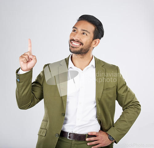 Image of Businessman, thinking and man pointing for promotion, deal and logo isolated in a studio white background with smile. Choice, corporate and happy person or employee showing advertising or news