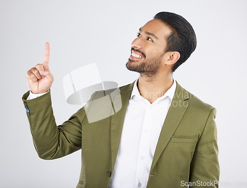 Image of Businessman, thinking and happy man pointing for promotion, deal and logo isolated in studio white background. Choice, corporate and person or employee showing advertising or news with smile