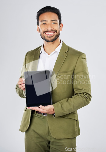 Image of Happy asian man, portrait and tablet mockup in advertising against a white studio background. Businessman with technology display or screen in marketing, advertisement or branding on mock up space