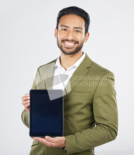 Image of Happy asian man, portrait and tablet on mockup in advertising against a white studio background. Businessman with technology display or screen in marketing, advertisement or branding on mock up space