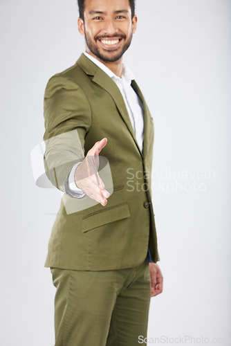 Image of Business man, handshake and offer for introduction, partnership and financial deal, success or welcome in studio. Professional person shaking hands in POV meeting and portrait on a white background