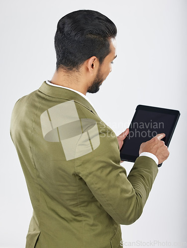 Image of Back, business and man with a tablet, career and professional on a white studio background. Japanese person, employee and accountant with tech, connection and data analysis with investment or trade