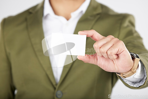 Image of Man, hand and business card in advertising, marketing or branding against a white studio background. Closeup of businessman with paper, poster or sign for contact information or services on mockup